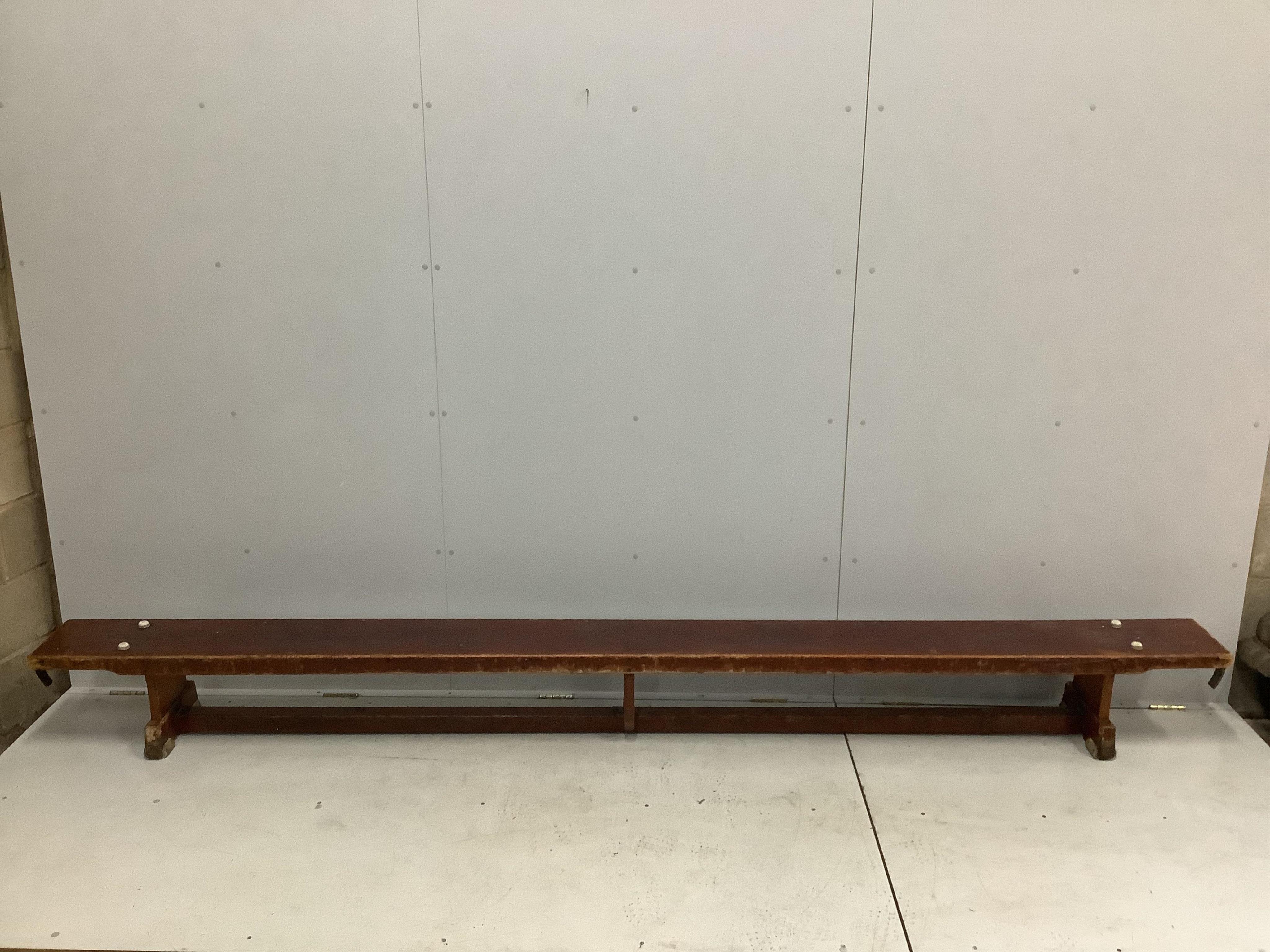 A set of three vintage stained beech gymnasium benches, length 335cm, height 31cm. Condition - well used but fair